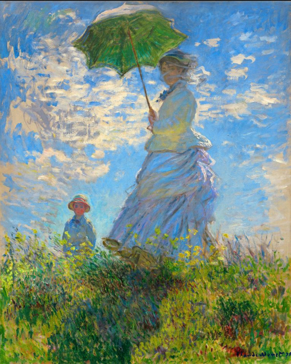 散歩、日傘をさす女性